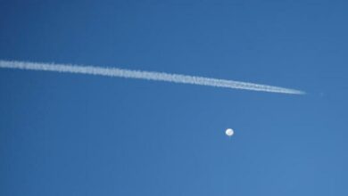 A jet flies by a suspected Chinese spy balloon reuters